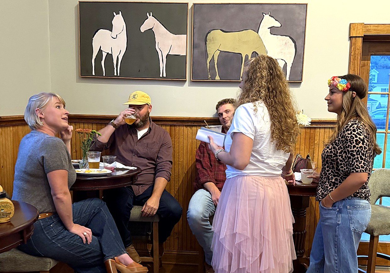 Guests in conversation at a table